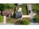 Aerial view showcasing a beautiful fenced yard with a patio, fire pit, storage shed and green space at 1700 Conductor Ln, Conyers, GA 30013