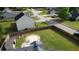 Aerial view of fenced backyard with manicured lawn, fire pit, patio, and shed on a corner lot at 1700 Conductor Ln, Conyers, GA 30013