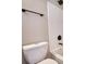 Bathroom with white tile shower, toilet, and dark bronze hardware at 1700 Conductor Ln, Conyers, GA 30013