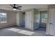Large bedroom with two windows allowing natural light and three doors at 1700 Conductor Ln, Conyers, GA 30013