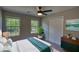 Bedroom with ample natural light, a large closet, modern decor, and gray walls at 1700 Conductor Ln, Conyers, GA 30013