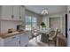 Dining room featuring a modern chandelier and ample space for hosting dinners at 1700 Conductor Ln, Conyers, GA 30013