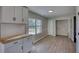 Dining room is lit by modern lighting and next to the kitchen for convenience at 1700 Conductor Ln, Conyers, GA 30013