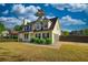 Beautiful two-story home with black shutters, well-maintained landscaping, and attached two car garage at 1700 Conductor Ln, Conyers, GA 30013