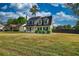 Attractive two-story home with black shutters, neat landscaping, and a large grassy front yard at 1700 Conductor Ln, Conyers, GA 30013