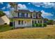Inviting two-story home with black shutters, landscaped front yard, and a welcoming front porch at 1700 Conductor Ln, Conyers, GA 30013