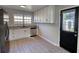 Bright kitchen with white cabinets, stainless steel appliances, and stylish granite countertops at 1700 Conductor Ln, Conyers, GA 30013