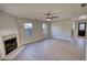 Bright living room featuring a fireplace, updated flooring and neutral paint at 1700 Conductor Ln, Conyers, GA 30013