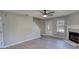Bright open living room with fireplace, updated flooring and neutral paint at 1700 Conductor Ln, Conyers, GA 30013