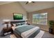 Bedroom featuring neutral tones, two windows, and a vaulted ceiling at 1700 Conductor Ln, Conyers, GA 30013