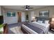Spacious main bedroom showcasing a modern ceiling fan, a king bed, and decor at 1700 Conductor Ln, Conyers, GA 30013