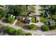 A vibrant neighborhood is seen from above, showcasing tree-lined streets and well-maintained homes at 1700 Conductor Ln, Conyers, GA 30013