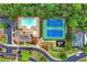 Overhead shot featuring community pool, tennis courts, playground, pavilion, well-maintained landscaping, and parking at 449 Highlands Loop, Woodstock, GA 30188