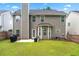 Backyard features a patio, well-kept lawn, and privacy fence creating an ideal space for outdoor activities and gatherings at 449 Highlands Loop, Woodstock, GA 30188