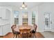 Charming dining area with natural light, perfect for Gathering meals and entertaining guests at 449 Highlands Loop, Woodstock, GA 30188