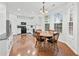 Bright kitchen and dining area, with stainless appliances, natural light, and stylish countertops at 449 Highlands Loop, Woodstock, GA 30188