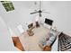 Bright living room with fireplace, ceiling fan, and lots of natural light from large windows at 449 Highlands Loop, Woodstock, GA 30188