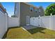 Fenced backyard with a concrete patio and grassy area, great for outdoor activities at 577 Cypher Dr, Suwanee, GA 30024