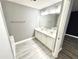 Bright bathroom featuring a double sink vanity and vinyl flooring at 577 Cypher Dr, Suwanee, GA 30024