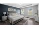 Virtually staged bedroom featuring tray ceilings, sleek floors, and lots of natural light at 577 Cypher Dr, Suwanee, GA 30024