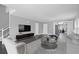 Open-concept living room features hardwood floors and seamlessly connects to the kitchen area at 577 Cypher Dr, Suwanee, GA 30024