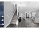 Inviting living room boasts hardwood floors and staircase leading to the upper level of the home at 577 Cypher Dr, Suwanee, GA 30024