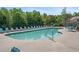 Inviting community pool with comfortable lounge chairs and ample seating for residents at 577 Cypher Dr, Suwanee, GA 30024