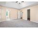 Large bedroom features vaulted ceilings, neutral walls and carpet, walk-in closet and ensuite bathroom at 6939 Waters Edge Dr, Stone Mountain, GA 30087