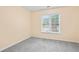 Bedroom featuring carpet and a window with a view of the neighborhood at 6939 Waters Edge Dr, Stone Mountain, GA 30087