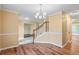 Inviting entryway featuring hardwood floors, staircase, and bright lighting at 6939 Waters Edge Dr, Stone Mountain, GA 30087
