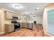 Spacious kitchen with stainless steel appliances, granite countertops, and hardwood floors at 6939 Waters Edge Dr, Stone Mountain, GA 30087