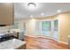 Bright eat-in kitchen area with natural light, stainless steel appliances, and hardwood floors at 6939 Waters Edge Dr, Stone Mountain, GA 30087