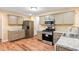 Modern kitchen with granite countertops and stainless steel appliances at 6939 Waters Edge Dr, Stone Mountain, GA 30087