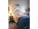Charming bedroom with a decorative headboard, bedside tables, and a comfortable floral patterned bed at 711 Cosmopolitan Ne Dr # 123, Atlanta, GA 30324