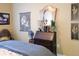 Cozy bedroom featuring antique furniture, decorative artwork, and a comfortable bed at 711 Cosmopolitan Ne Dr # 123, Atlanta, GA 30324