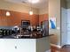 Modern kitchen with wood cabinets, black countertops, stainless steel appliances, and stylish pendant lighting at 711 Cosmopolitan Ne Dr # 123, Atlanta, GA 30324