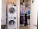 Laundry Room and Closet area with stacked washer and dryer units next to custom closet with plenty of storage space at 711 Cosmopolitan Ne Dr # 123, Atlanta, GA 30324