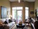 Bright living room featuring a balcony, comfortable seating, hardwood floors, and neutral color palette at 711 Cosmopolitan Ne Dr # 123, Atlanta, GA 30324