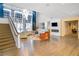 Spacious lobby boasts high ceilings, modern chandelier, cozy seating, fireplace and stylish staircase at 711 Cosmopolitan Ne Dr # 123, Atlanta, GA 30324