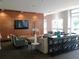 Inviting lounge area with wood accent wall, tv, and comfortable seating arrangement at 711 Cosmopolitan Ne Dr # 123, Atlanta, GA 30324