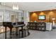 Relaxing lounge area with a grand piano, modern lighting, console table, and comfortable seating at 711 Cosmopolitan Ne Dr # 123, Atlanta, GA 30324