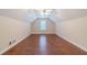 Bright attic featuring new hardwood floors and a single window at 1022 Pecan Grove Pl, Lawrenceville, GA 30046