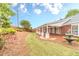 Backyard featuring a covered patio, fountain and manicured lawn at 1022 Pecan Grove Pl, Lawrenceville, GA 30046