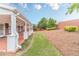 Backyard showcasing a covered patio and manicured lawn at 1022 Pecan Grove Pl, Lawrenceville, GA 30046