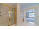 Spacious bathroom showing a soaking tub and a separate, glass-enclosed shower at 1022 Pecan Grove Pl, Lawrenceville, GA 30046