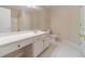 Bathroom featuring a single sink vanity, with tile flooring and a separate shower at 1022 Pecan Grove Pl, Lawrenceville, GA 30046