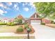 Charming one-story brick home featuring a well-maintained lawn and a two car garage at 1022 Pecan Grove Pl, Lawrenceville, GA 30046