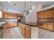 Spacious kitchen featuring light wood cabinetry, granite countertops, and stainless steel appliances at 1022 Pecan Grove Pl, Lawrenceville, GA 30046