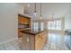 Kitchen island with wood cabinets and granite countertop with seating at 1022 Pecan Grove Pl, Lawrenceville, GA 30046