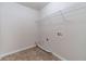 Utility room featuring washer hookups and tile floors at 1022 Pecan Grove Pl, Lawrenceville, GA 30046